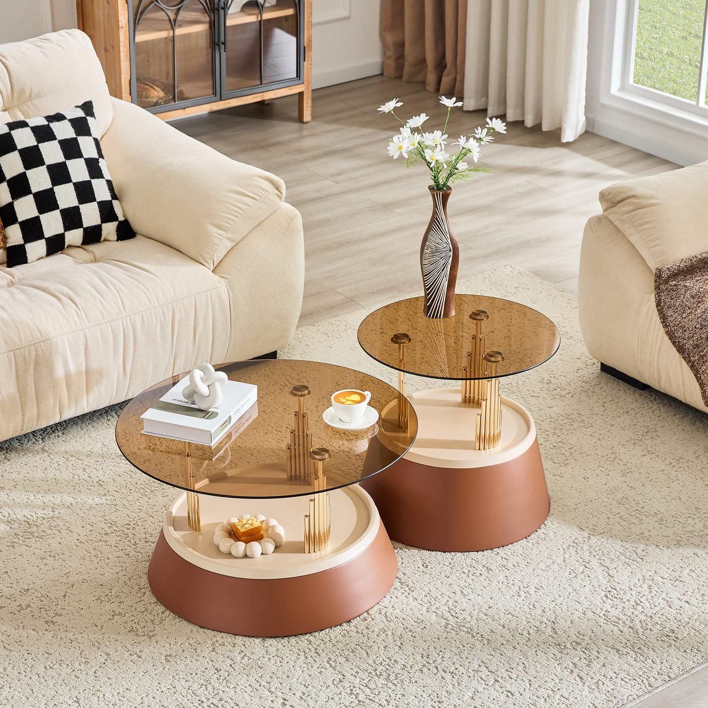 Luxury-inspired brown and gold nesting coffee table set.