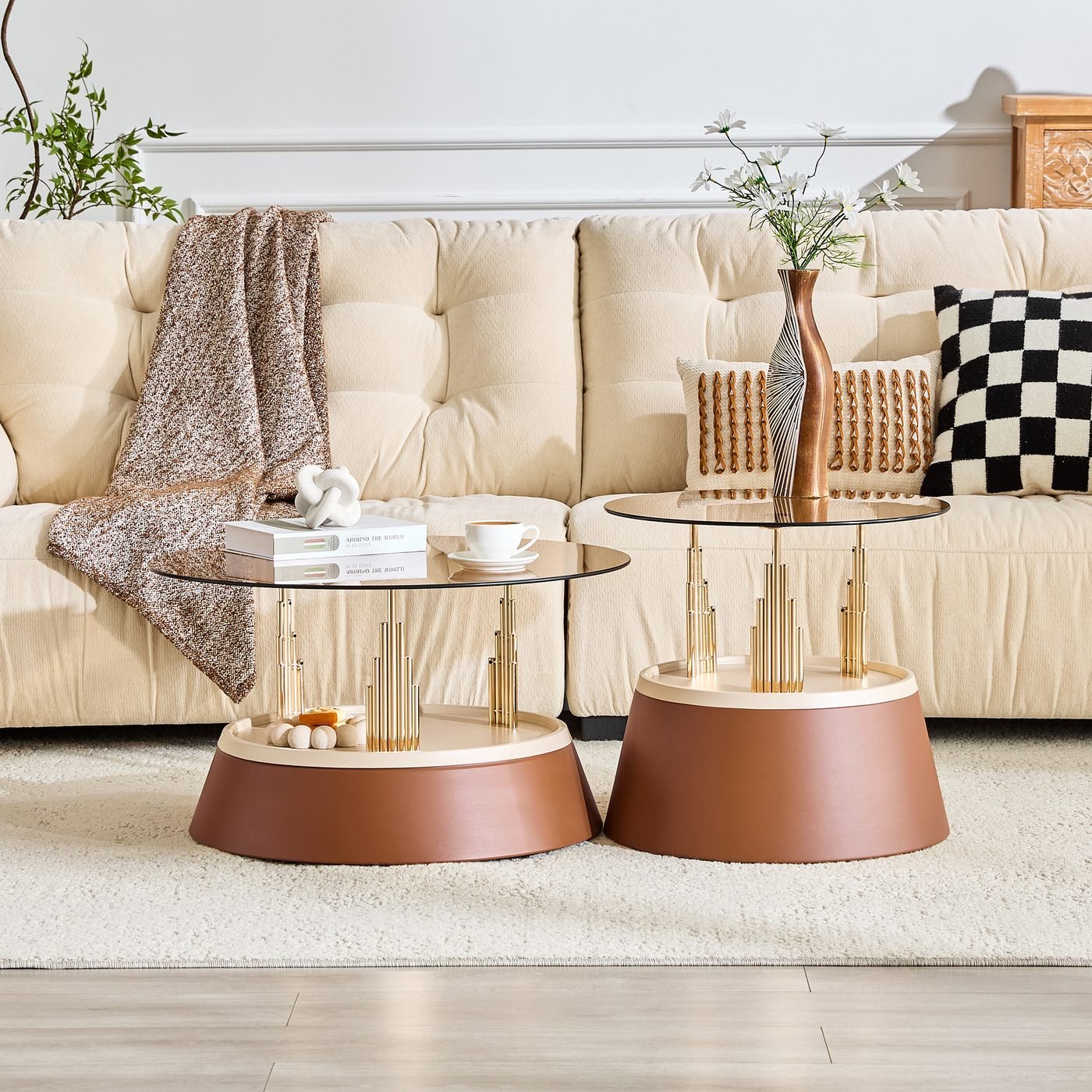 Luxury-inspired brown and gold nesting coffee table set.